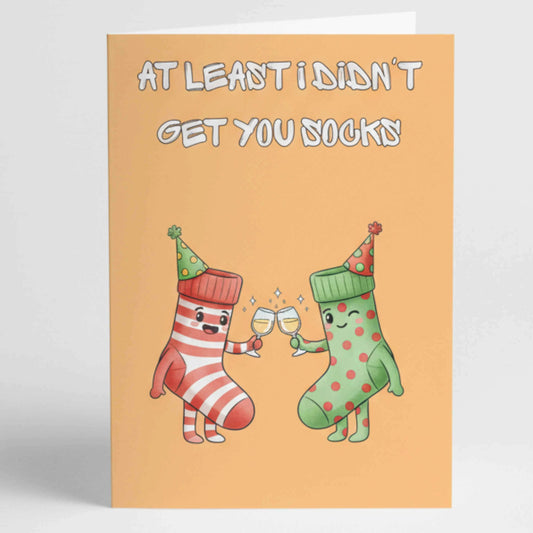 Минималистична забавна картичка с надпис на английски At least I didn't get you socks, изчистен шрифт и забавен дизайн, подходящ за рожден ден на приятел, брат или колега.