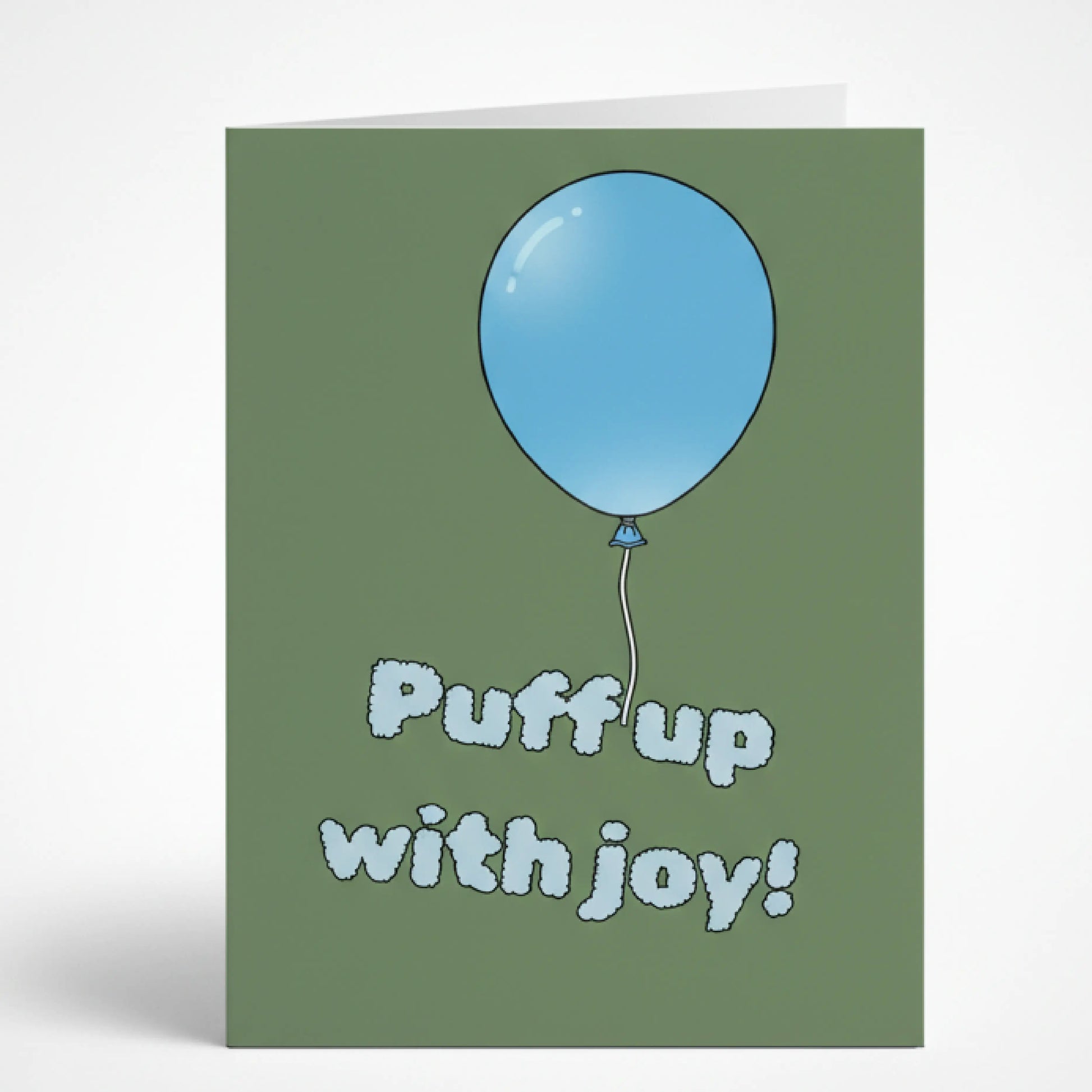 Зелена поздравителна картичка на английски език с илюстрация на голям син балон и закачлив надпис Puff up with joy!, изписан с пухкави букви като облаци.